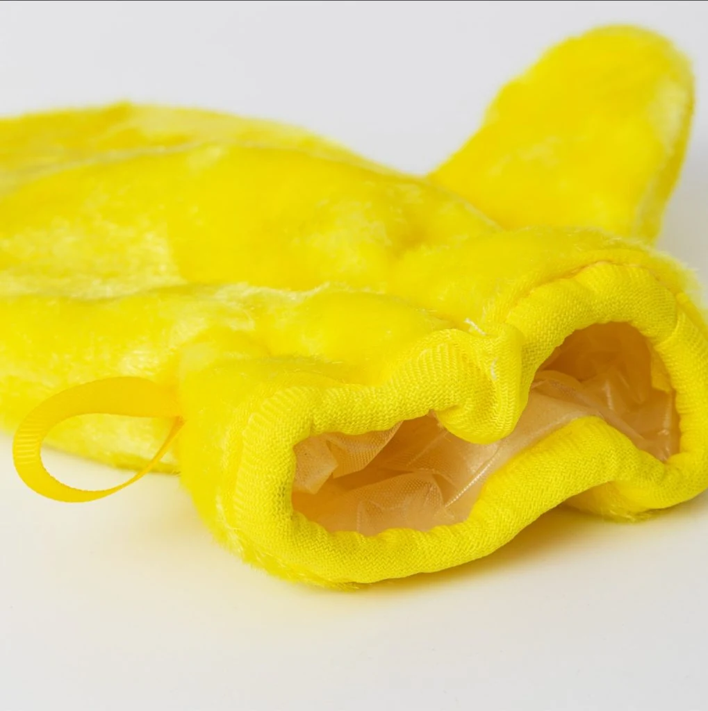 Biodegradable cleaning glove shown as a reusable kitchen grease removal tool.