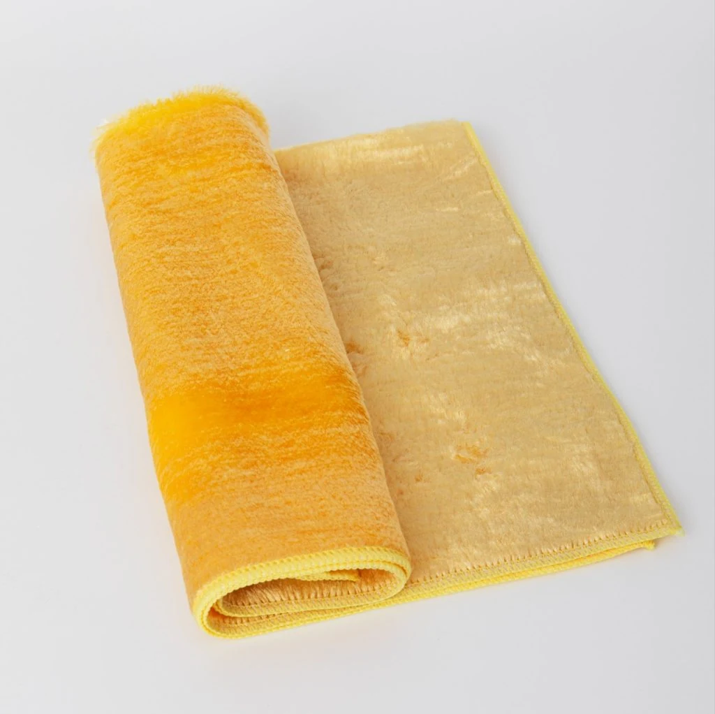 Folded industrial viscose wiping cloth showing product thickness and handling size.